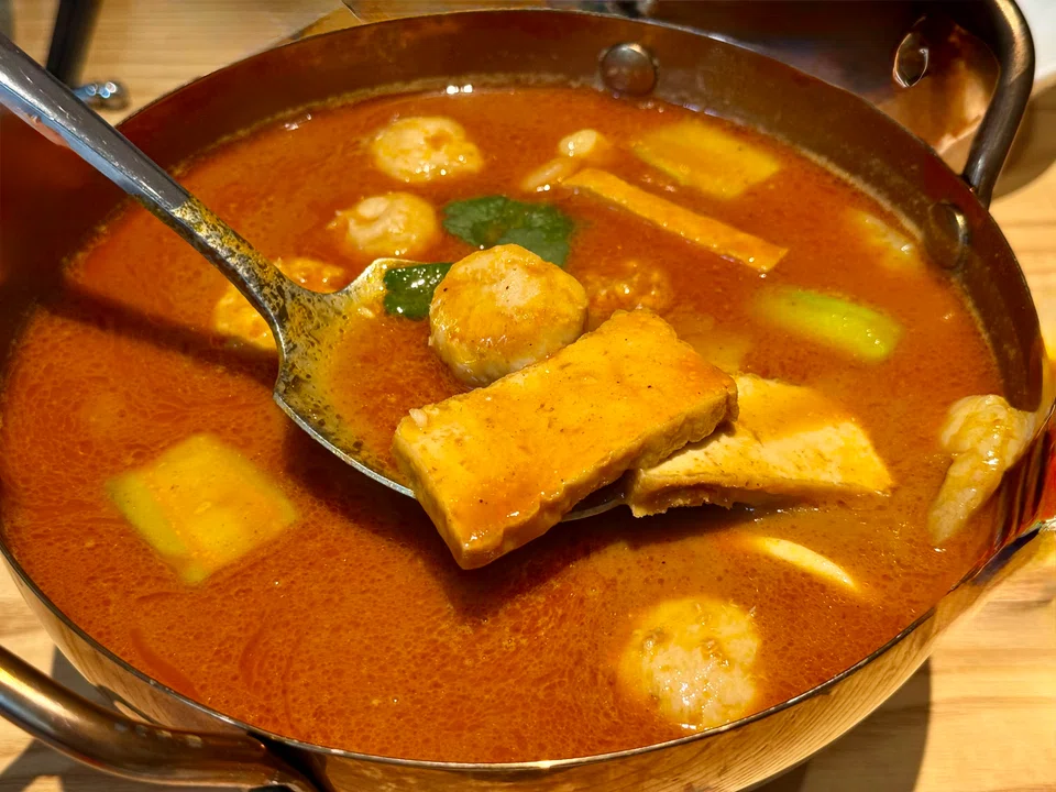 Satay hotpot features ingredients in a soupy gravy.