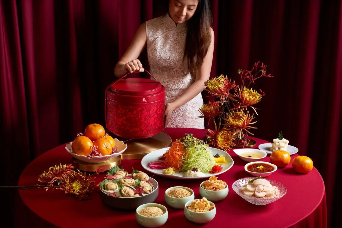 The Prosperity Yu Sheng is presented in an elegant vegan leather box with delicate floral cut-outs.