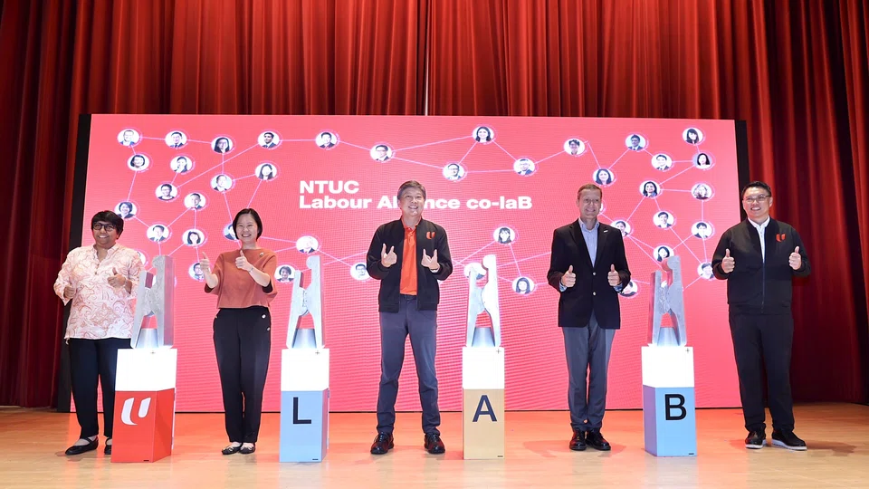 From left: NTUC president K Thanaletchimi; Minister of State Gan Siow Huang; NTUC secretary-general Ng Chee Meng; Singapore National Employers Federation vice-president Alexander Melchers;
NTUC assistant secretary-general Patrick Tay.