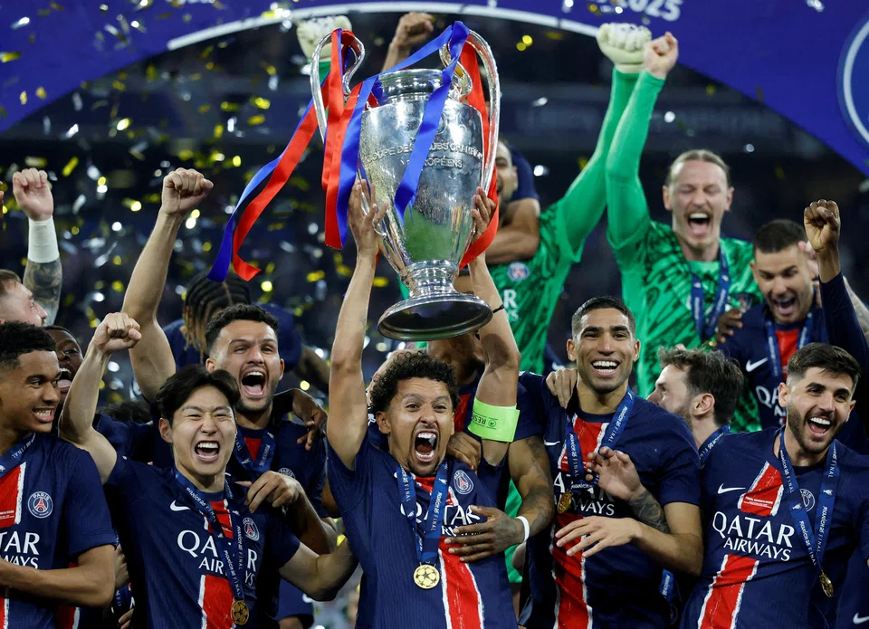 PSG captain Marquinhos lifts the trophy after leading the team to a 5-0 win over Inter in the Champions League final in Munich.