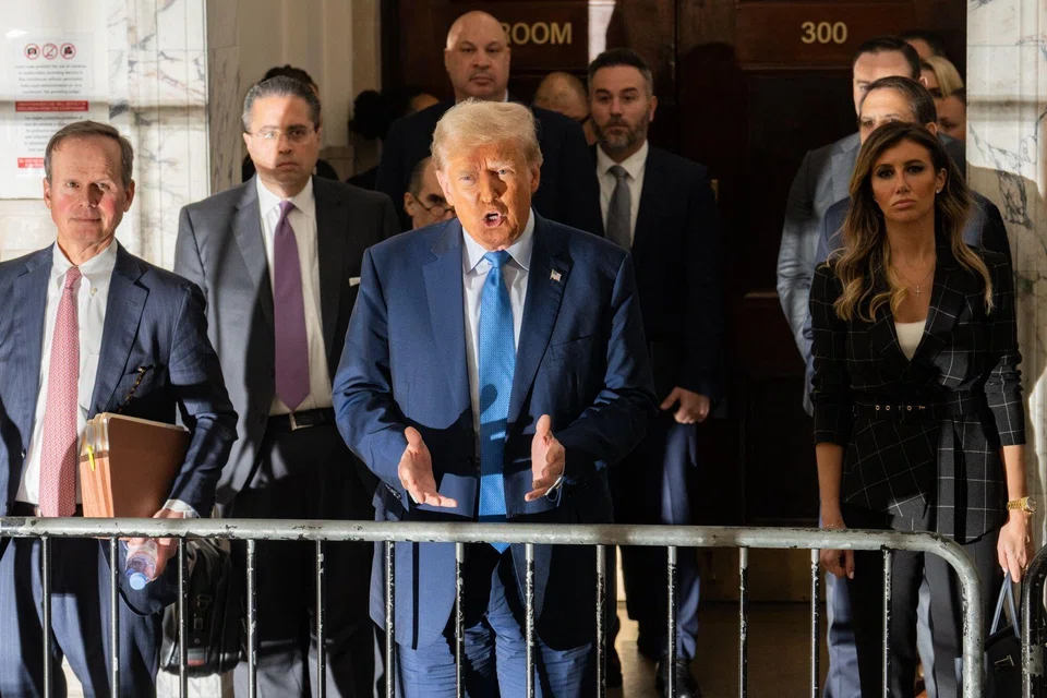 Former US President Donald Trump (centre) speaks to members of media at New York State Supreme Court in New York, US, Nov 6, 2023. 