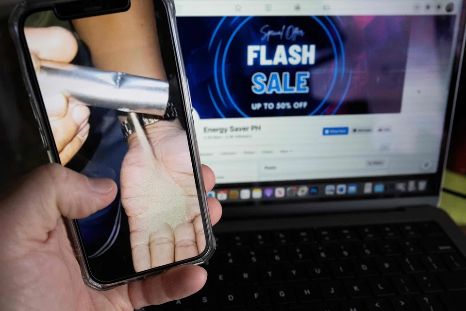 A phone screen displaying a video about a Filipino woman finding sand in her power bank she had purchased from a Facebook page.
