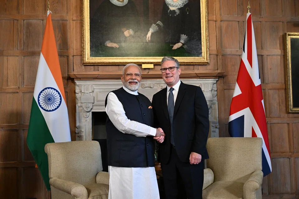 UK Prime Minister Keir Starmer (right) and India's Prime Minister Narendra Modi shake hands before their bilateral meeting and the signing of the free trade agreement between two countries, at Chequers, in Aylesbury, UK, on Jul 24. 