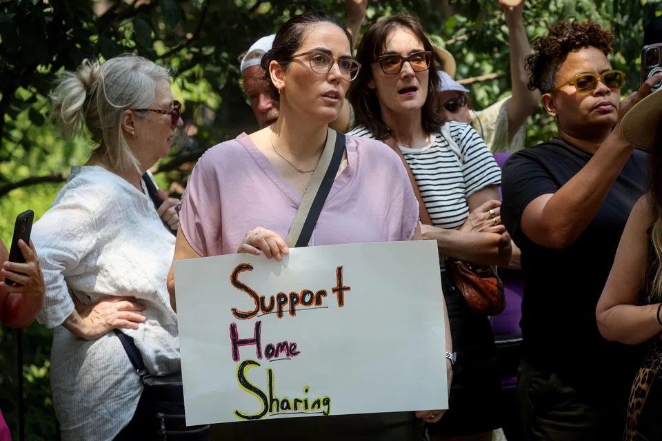 People attend a protest rally against New York City’s law against short-term rentals and Airbnb's in New York City, US, July 12, 2023.  