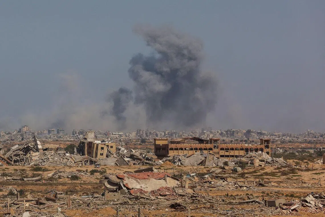 Smoke billows following an Israeli strike in Gaza City, on Oct 2, 2025, as pictured from Nuseirat in central Gaza.