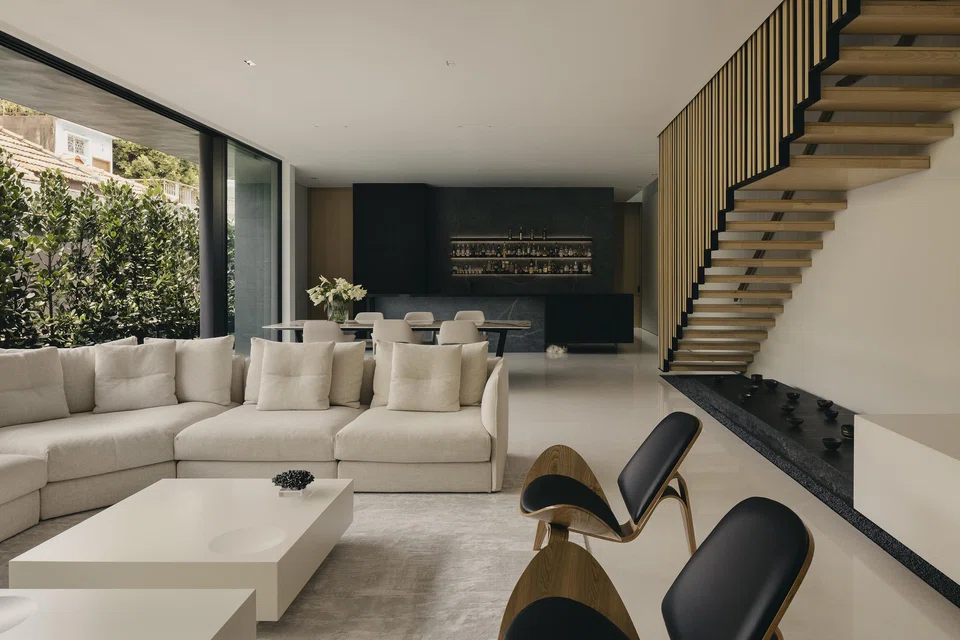 The living area with the bar counter where the son mixes drinks for his family.