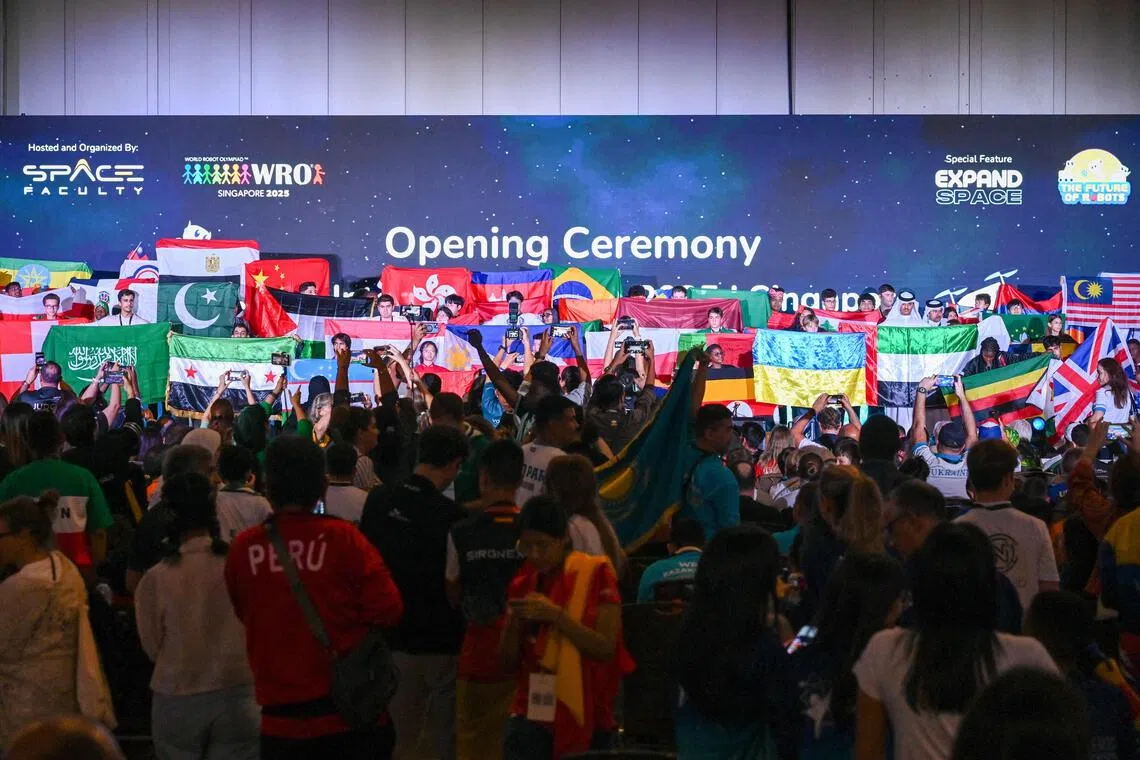 Participants from more than 90 countries attend the opening ceremony of the World Robot Olympiad competition in Singapore on Nov 26. 