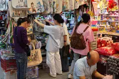 Retail sales growth slowed last month as spending continued to lag amid job insecurity and stagnant new home prices.