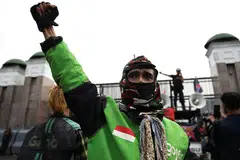 A ride-hailing motobike rider during a protest in Jakarta streets last September. Since then, Indonesian President Prabowo Subianto has been under pressure to respond to drivers’ demands for better pay and conditions.