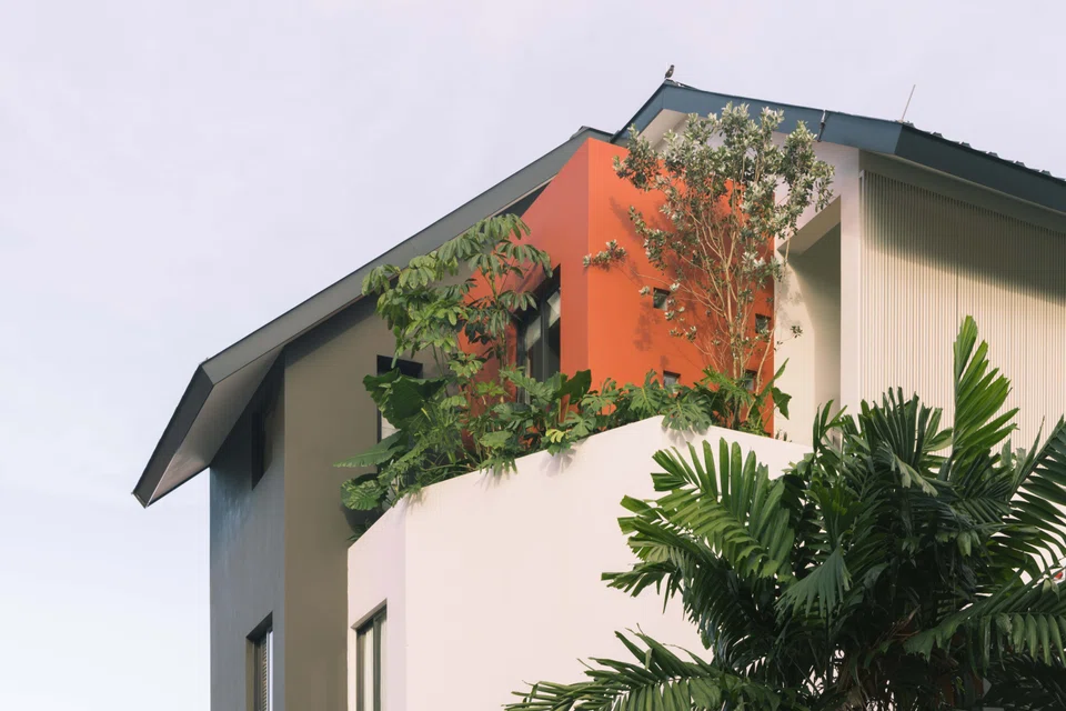 The daughter's bedroom is deliberately sunken for privacy and looks like a red box from the outside.