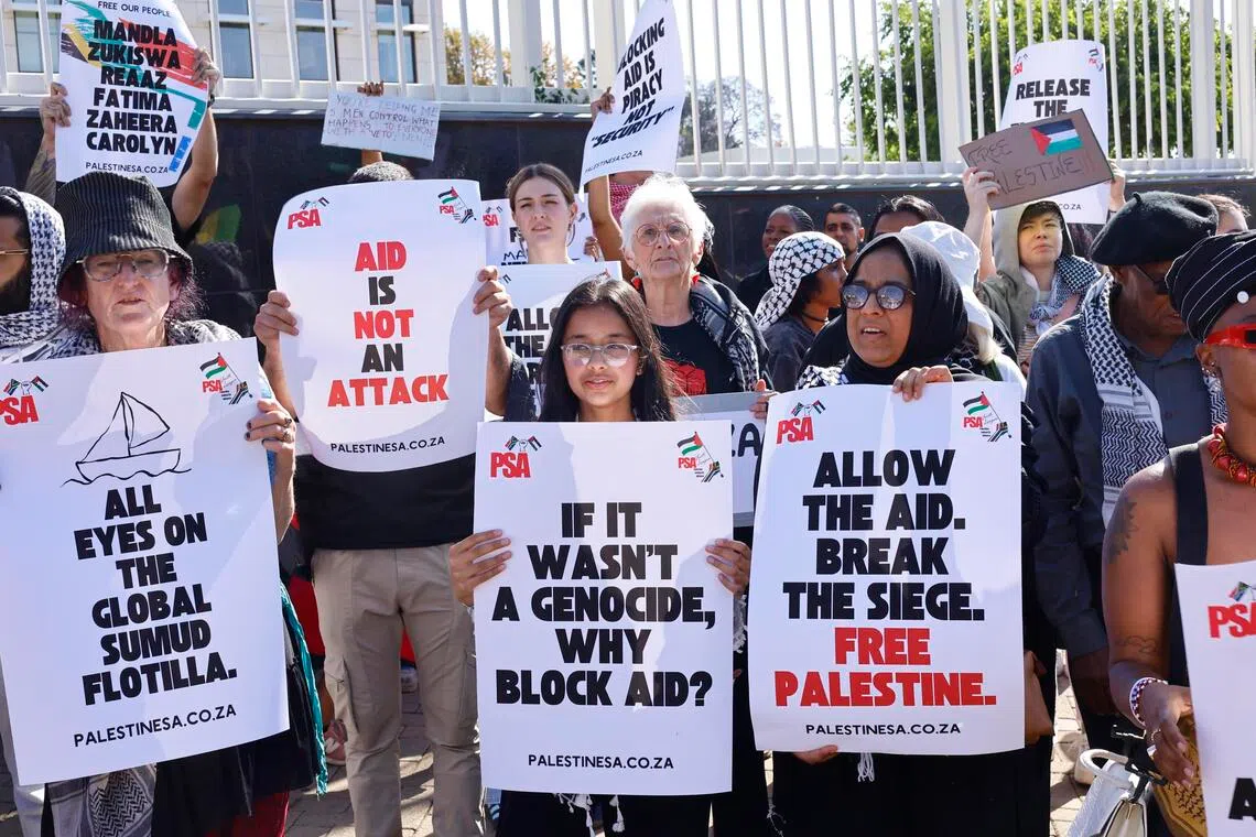 Protesters gather outside the United States embassay to protest against the arrest of South African MP Mandla Mandela and other activists onboard various boats off Gaza, in Johannesburg, South Africa, Oct 3 2025.  Hamas said that it had agreed to release all of the Israeli hostages held in Gaza as well as the bodies of those who had died, in response to the peace proposal introduced by President Donald Trump earlier this week. 