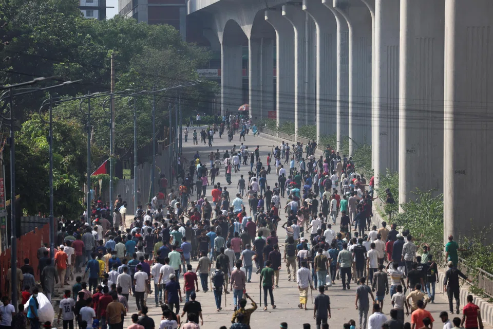 Anti-government protesters clash with police and pro-government supporters,  Dhaka, Bangladesh, Aug 4, 2024. 