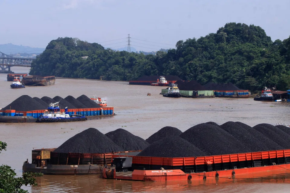 Coal is transported on barges in Indonesia. The country's 660-megawatt Cirebon-1 coal plant will likely cease operations in December 2035 – seven years earlier than its original retirement date of July 2042.