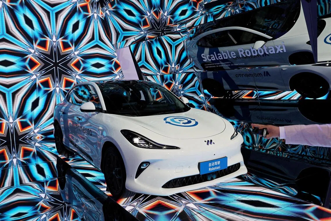 A Momenta Robotaxi is displayed at the booth of the Chinese autonomous driving startup during a media day for the Auto Shanghai show in Shangha on Apr 23.