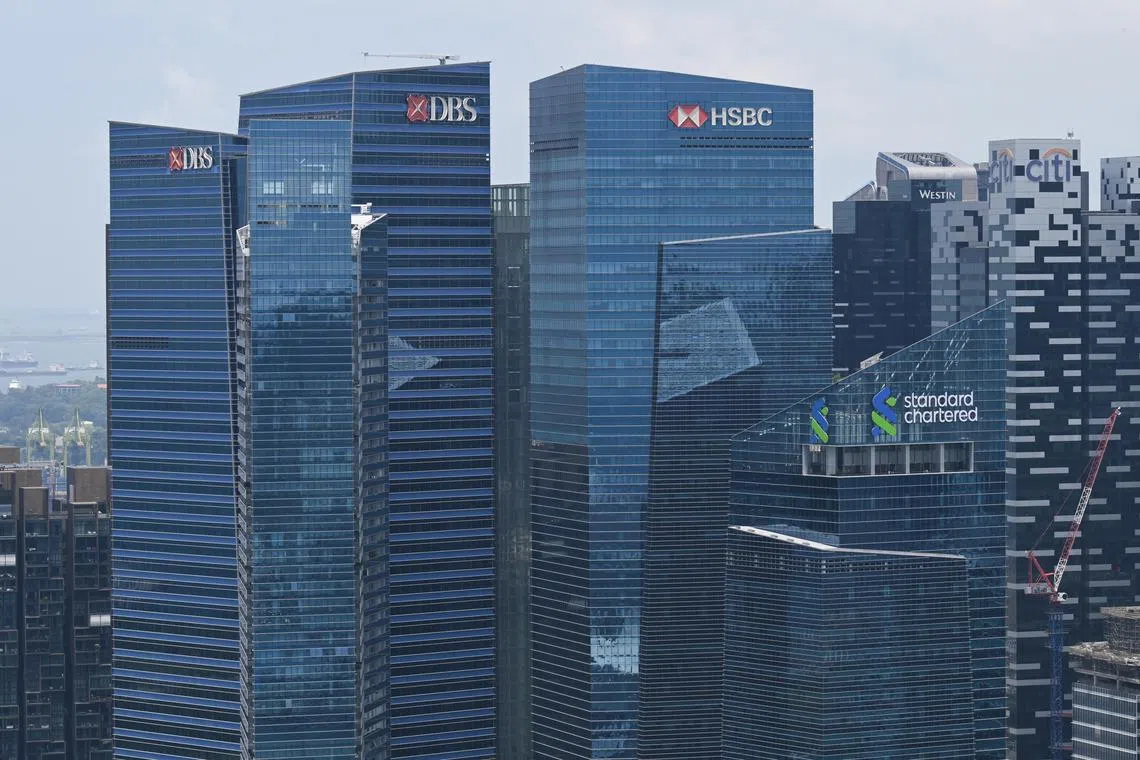 Marina Bay Financial Centre with banks DBS, HSBC and Standard Chartered, as seen from the SkyPark Observation Deck at Marina Bay Sands on Sep 8, 2023.