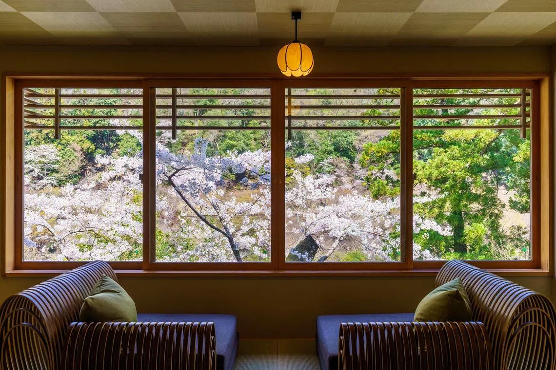 At Hoshinoya Kyoto, views are maximised with custom-designed sofas that sit close to the ground and face the river.
