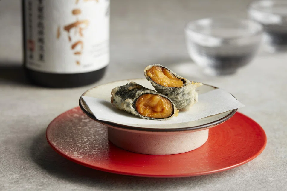 Uni wrapped in seaweed is creamy and chewy.