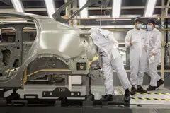 The automaker is simultaneously dealing with intense competition in China and an uncertain global environment as tariffs and sanctions against Chinese-made cars grow.