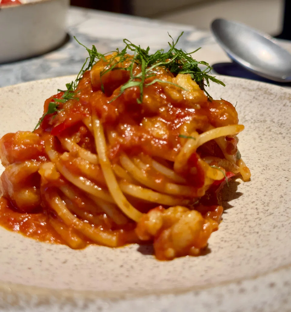 Pasta and monkfish in an intense tomato sauce.