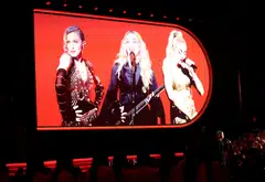 Madonna will have 24 onstage performers, four of her children will also be on stage, and she will be  transported high up around the arena “in an illuminated portal frame that acts as a time machine”.