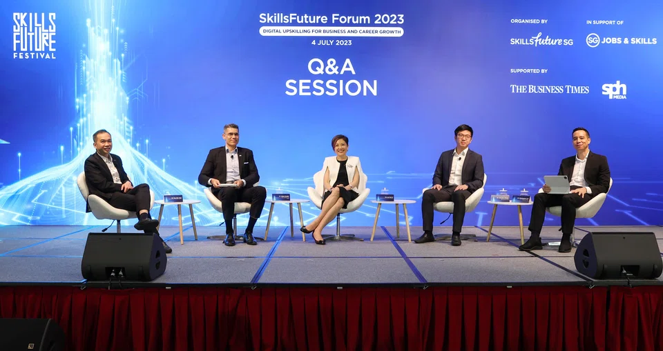 Panellists at the Skillsfuture Forum 2023. (from left): Tan Kok Yam, chief executive of SkillsFuture Singapore; Aslam Sardar, chief executive officer, Institute for Human Resource Professionals; Lee Hui Li, managing director, Microsoft Singapore; Lee Kian Chong, CEO, Deli in the Park; Christopher Lim, associate editor (product), The Business Times.