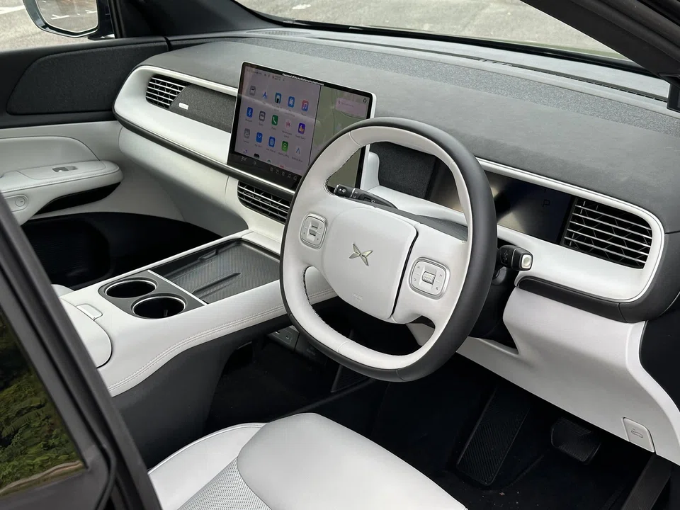 The interior is the perfect blend of muted colours and clean lines with no physical buttons on the dashboard.