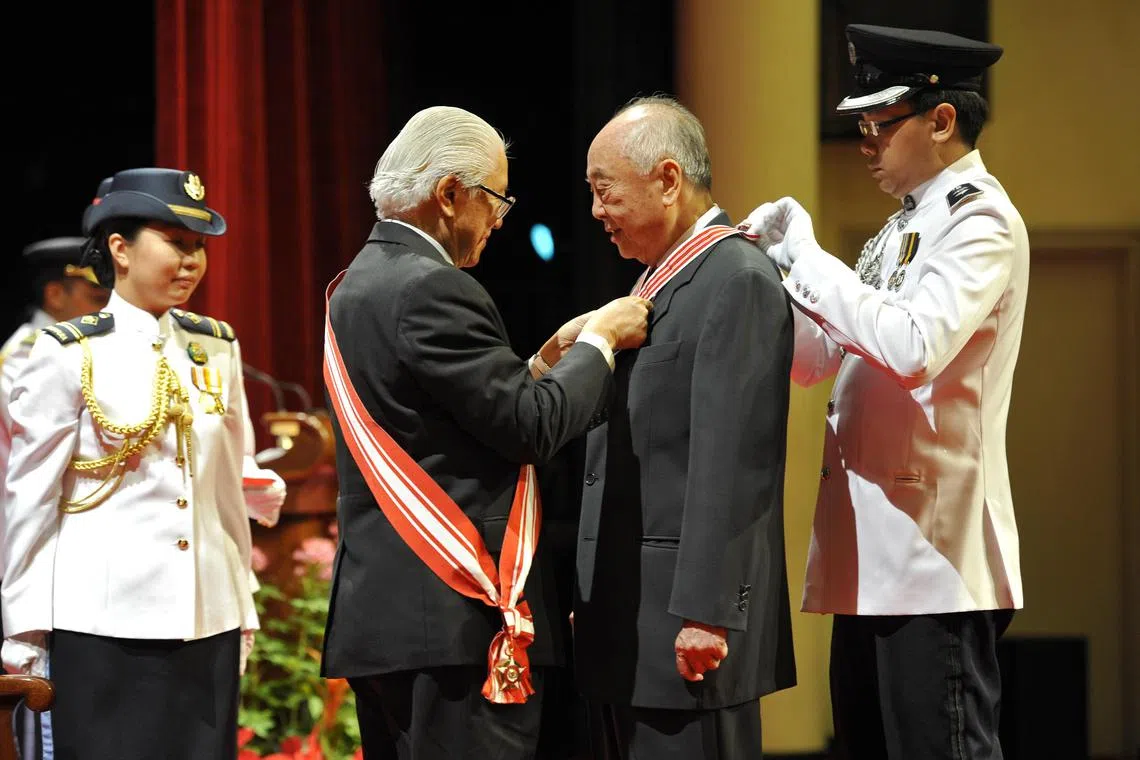 Wee receiving the Distinguished Service Order Medal from then president Tony Tan at the National Day awards in 2011.