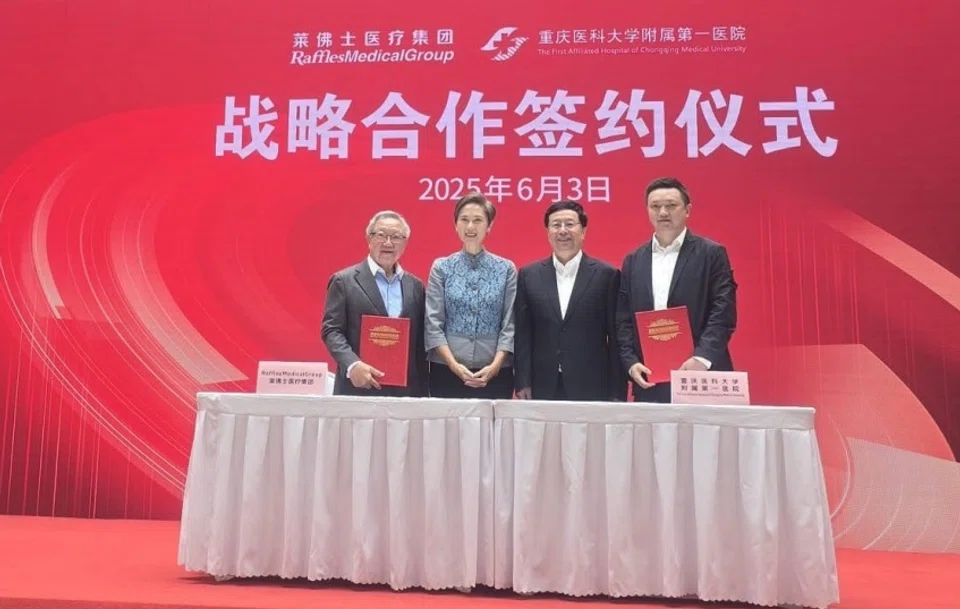 At the signing ceremony were (from left): Dr Loo Choon Yong, Raffles Medical Group executive chairman; Minister for Digital Development and Information Josephine Teo; Hu Henghua, mayor of Chongqing; and Wu Hao, the First Affiliated Hospital of Chongqing Municipality party committee secretary. 