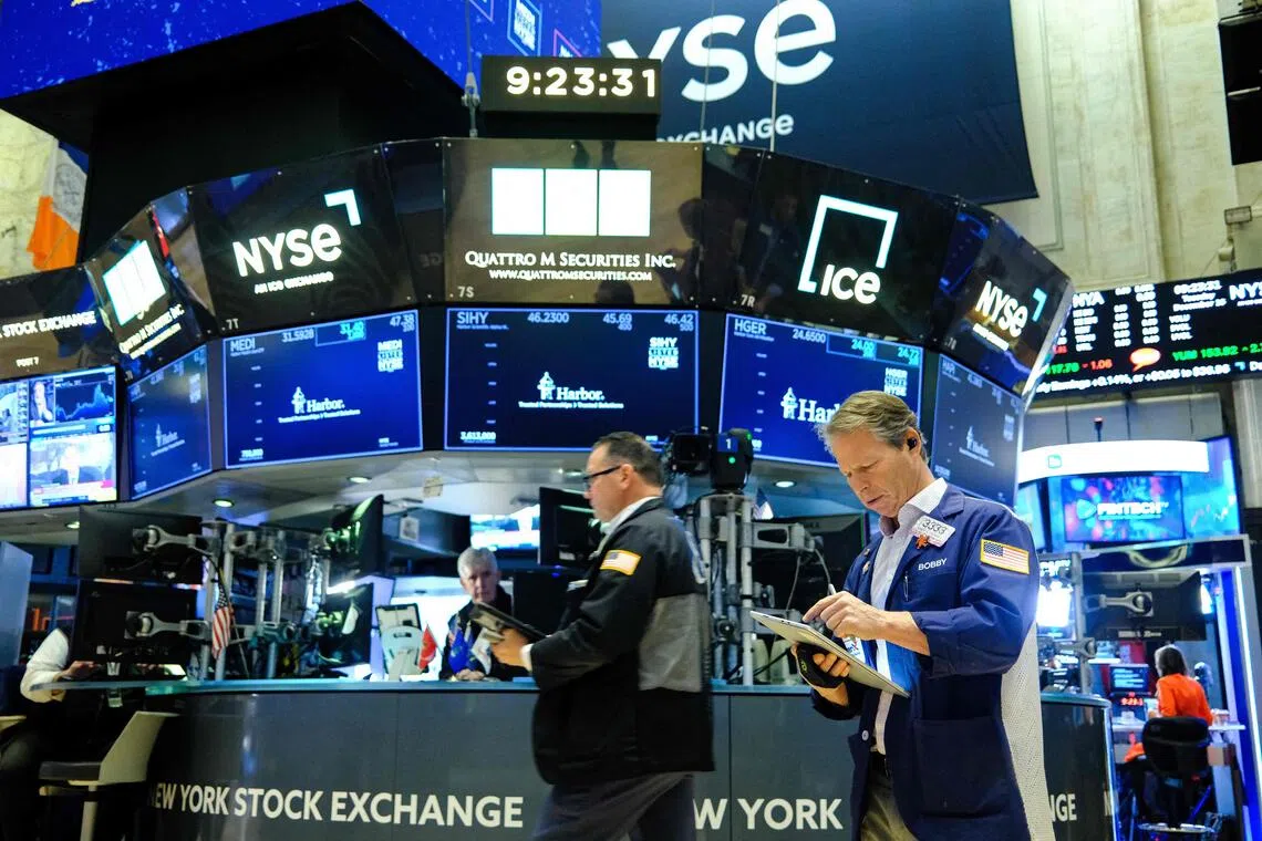 The S&P 500 and the Nasdaq hovered near their three-week lows as persistent uncertainty over rate cuts and concerns about lofty tech valuations continued to weigh on market sentiment.