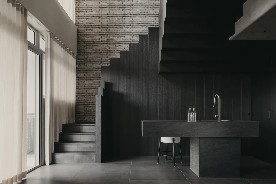 The staircase design accentuates the home's double volume.