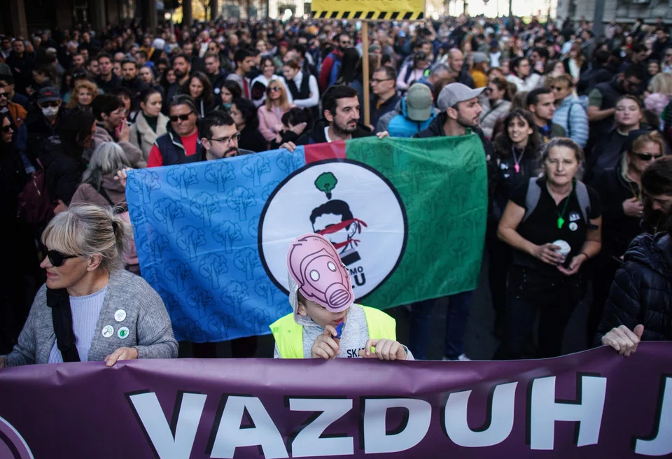 Demonstrators march during a "For our Children” protest against pollution in Belgrade, on Nov 13, 2022. Around the world, environmental issues affect billions of people, contributing to population displacement, social instability and conflict.