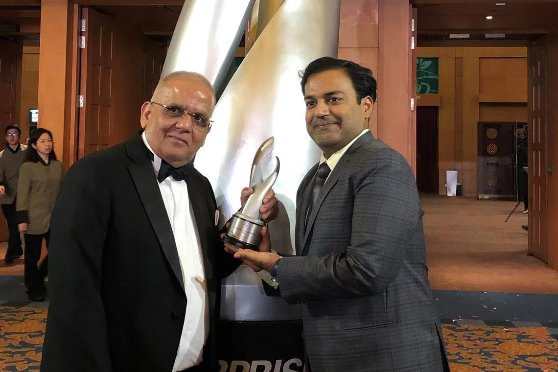 Khaitan International’s chairman and founder Pawan Khaitan (left) with his son, senior executive Manish Khaitan (right), at the 2018 Enterprise 50 Awards.