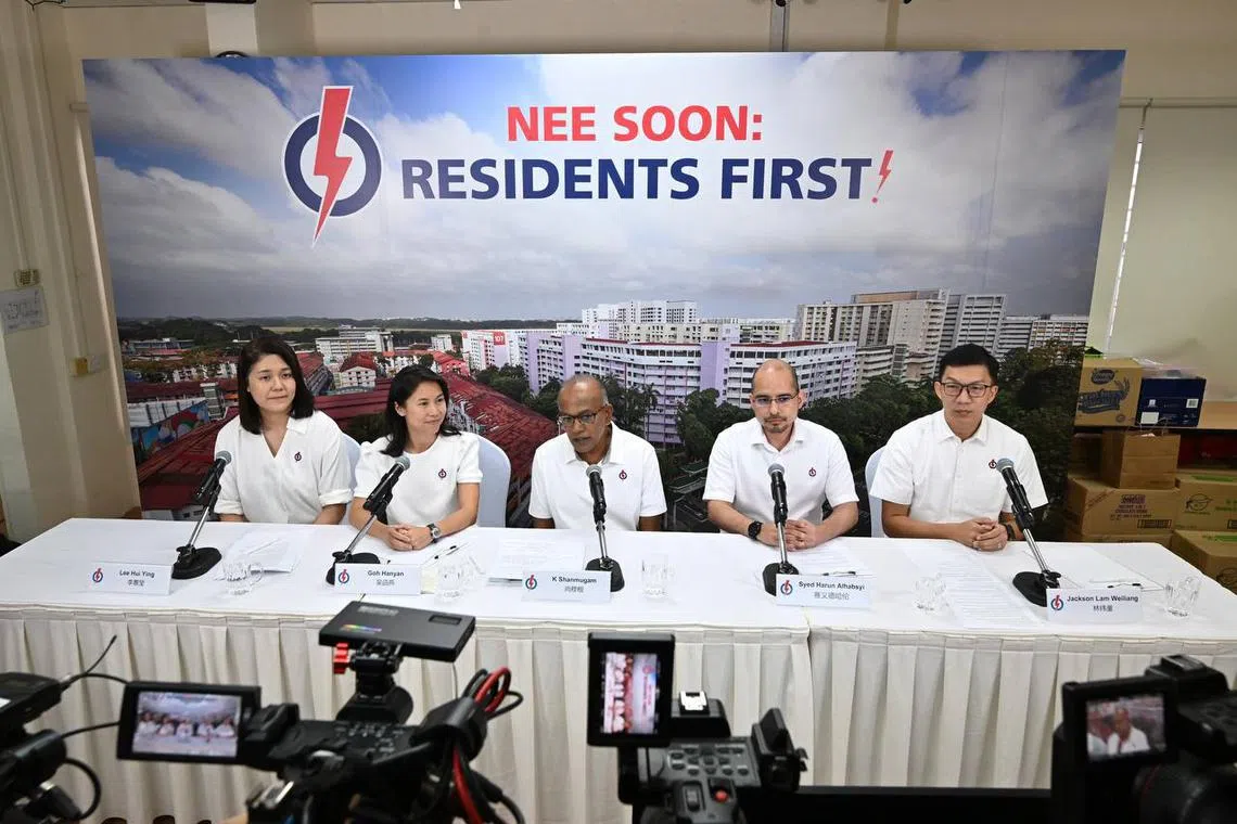Law and Home Affairs Minister K Shanmugam (centre) with (from left) Lee Hui Ying, Goh Hanyan, Syed Harun Alhabsyi and Jackson Lam at PAP Chong Pang Branch on Apr 21.