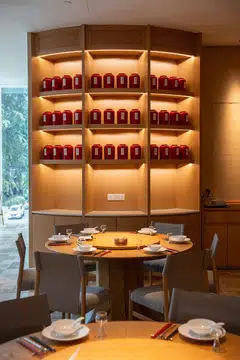 Ban Lan features a wall of red tea tins as its focal point.