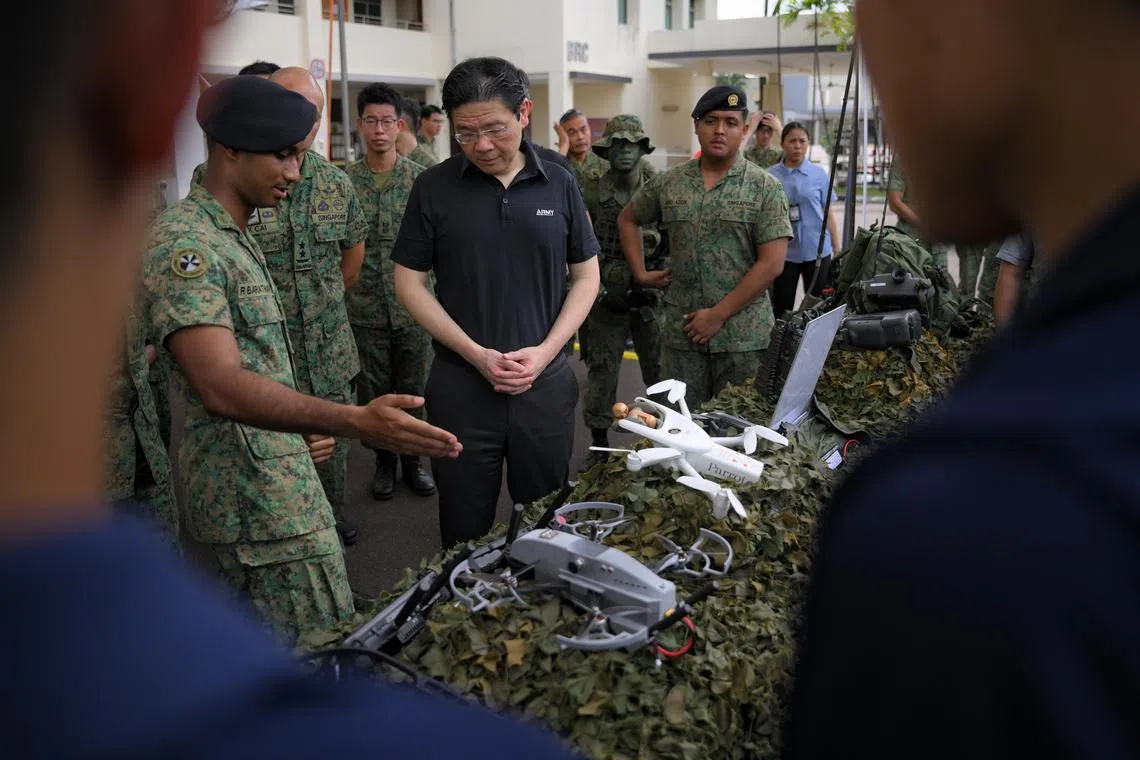 Prime Minister Lawrence Wong on a tour of the static drone display during his visit to Mandai Hill Camp on Thursday (Apr 9).