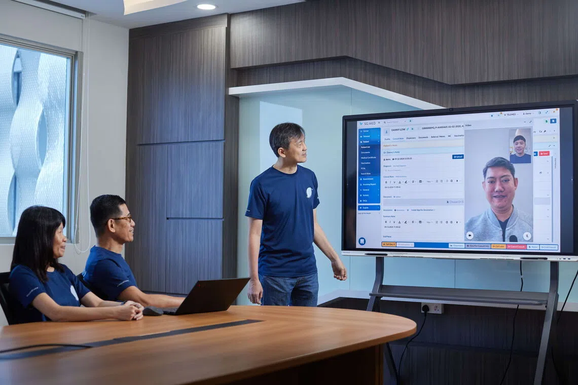 Among the projects led by chief technology officer Rodney Yeo (standing) was the upgrade of Alliance Healthcare Group's (AHG) HeyAlly app, which lets patients book teleconsultations or join a digital queue at its 19 GP clinics.