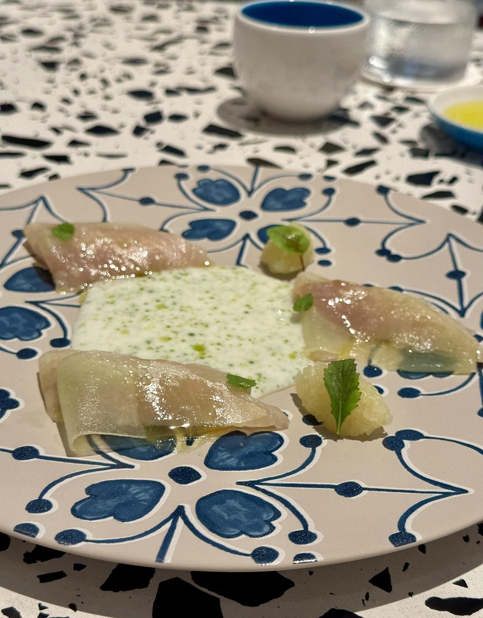 Smoked hamachi and pressed melon is a riff on prosciutto and melon.