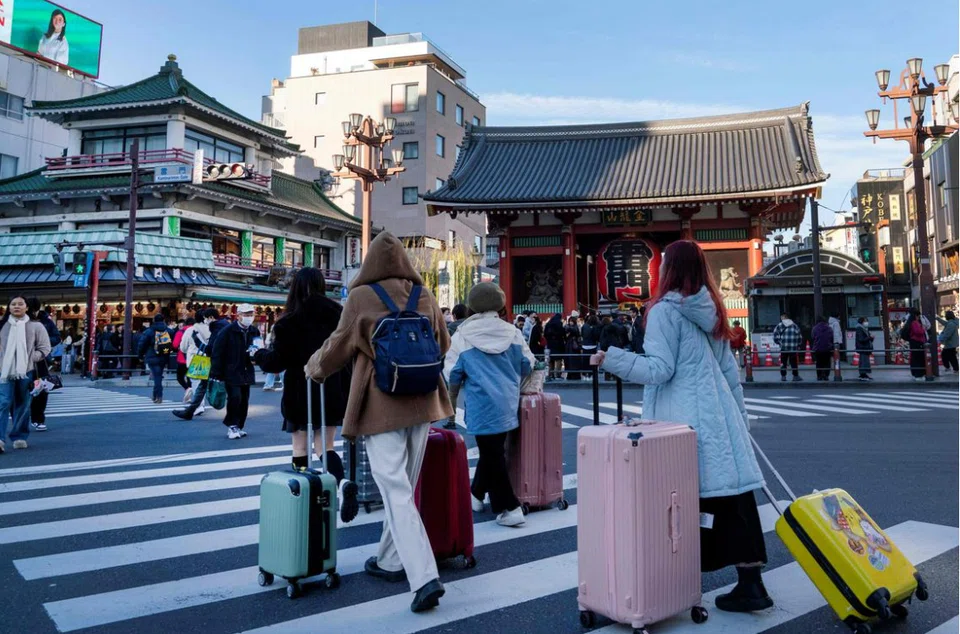 Out of the 691,000 travellers in 2024, 136,200 –  almost one-fifth of them –  flew to the Land of the Rising Sun in December alone. PHOTO: AFP