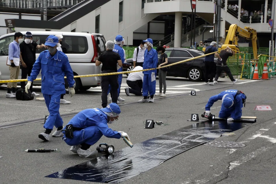 Police officers at the scene where Former Japanese Prime Minister Shinzo Abe was shot during a political event in Nara, Japan, on July 8, 2022. 