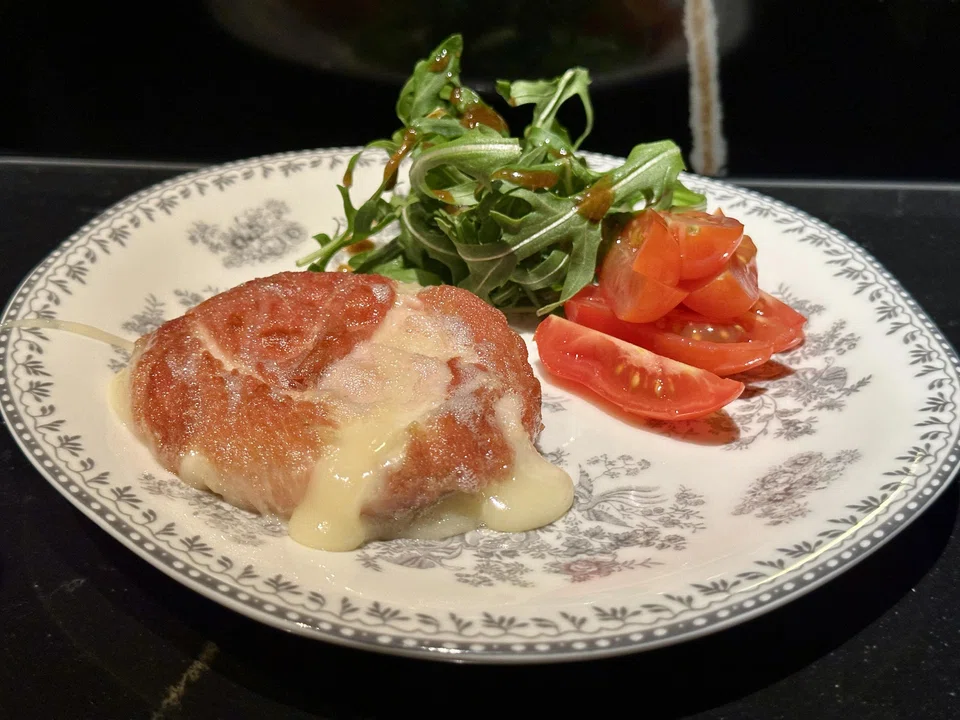 Pan-fried tomino cheese is served with sweet Japanese tomatoes.