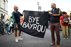 People celebrate after France's prime minister Francois Bayrou failed to win a confidence vote in parliament, outside the City Hall in Nantes, France, Sep 8, 2025. 