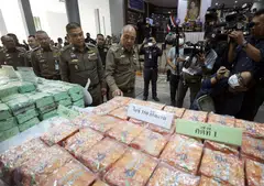 Thai national deputy police chief Chinnapat Sarasin looking at confiscated crystal methamphetamine and other drugs types during a press conference at the Narcotics Suppression Bureau in Bangkok on 13 June 2023. The narcotics incinerated on Monday (Jun 26) included 27 tons of amphetamines, 5 tons of cathinone, 275 kg of heroin, 43 kg of cocaine and 6 kg of opium.