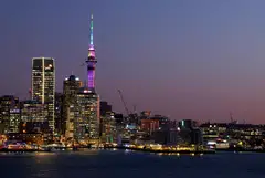 The Auckland skyline at sunset. More than 71,000 New Zealand citizens left the country over the 12 months ending in October, far more than the roughly 26,000 who returned, according to official estimates. 