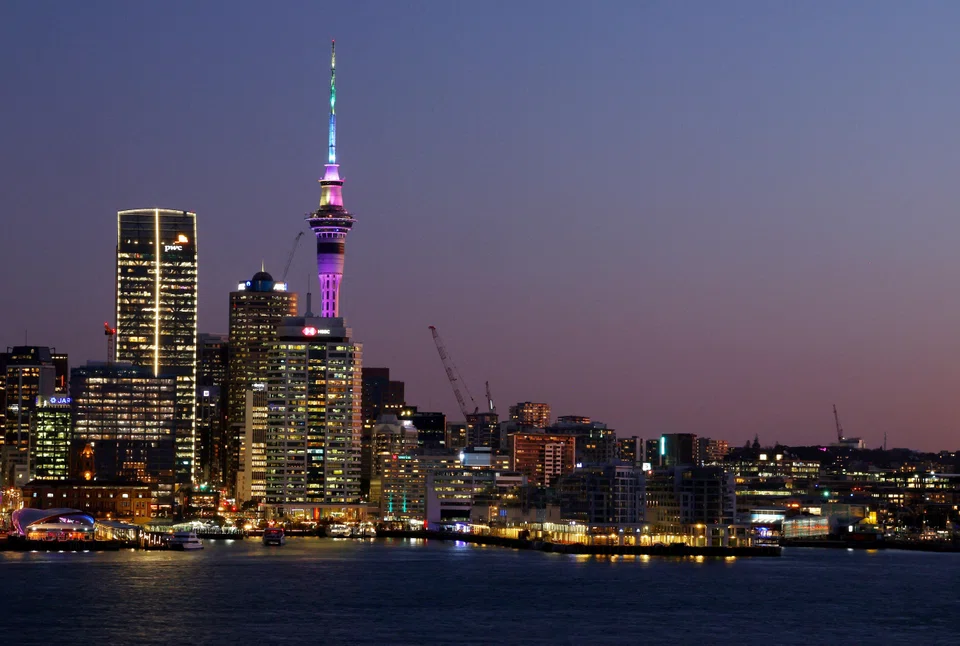 The Auckland skyline at sunset. More than 71,000 New Zealand citizens left the country over the 12 months ending in October, far more than the roughly 26,000 who returned, according to official estimates. 