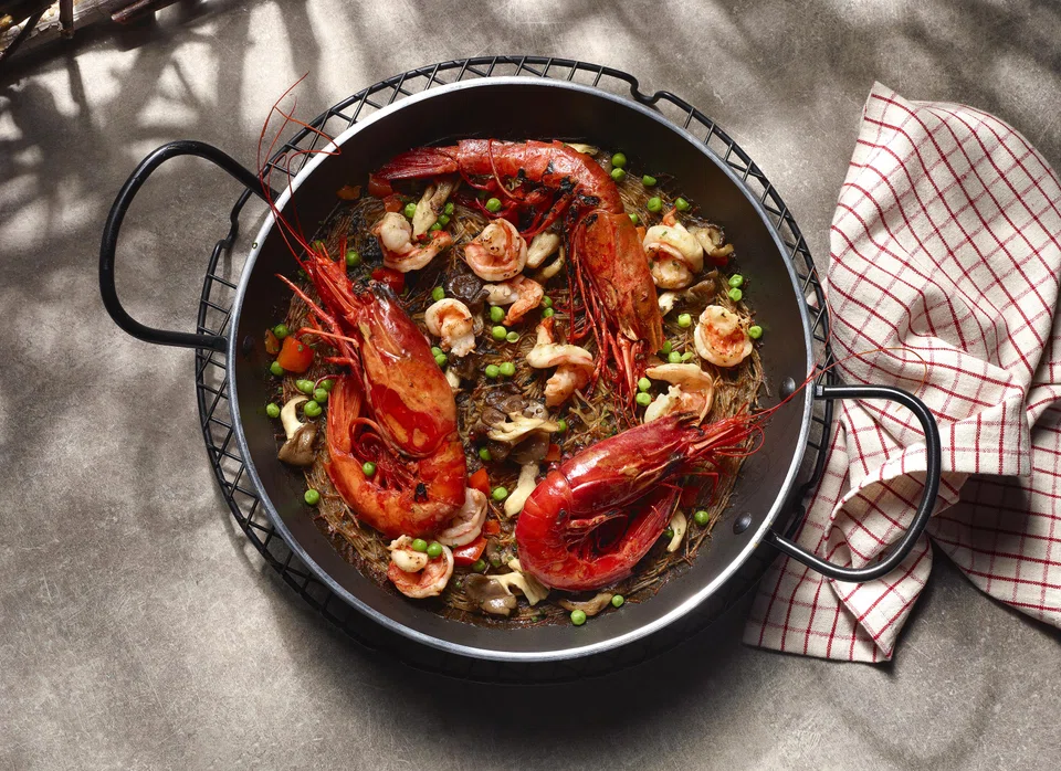 Fideua noodles are decorated with large and super fresh carabinero prawns.