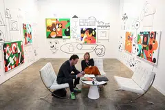 Gallerists manning one of the over 170 booths at Art Basel Hong Kong selling modern and contemporary art.