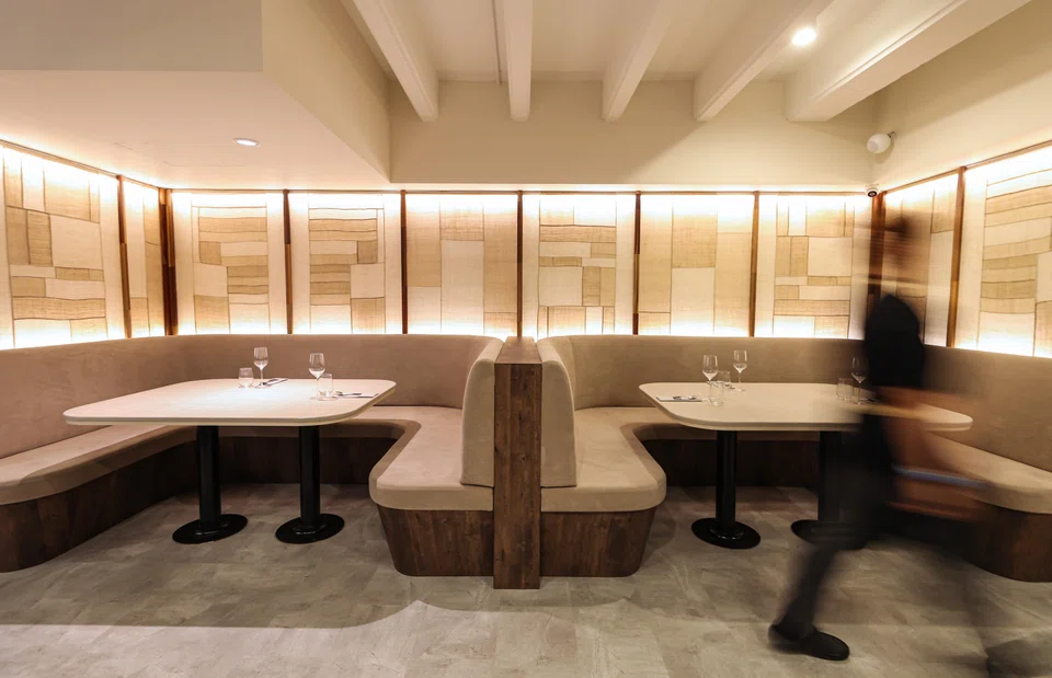 ONMI's calm, hanok-inspired eatery features geometric patterned wall accents.