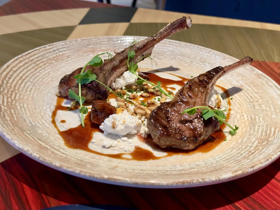 Lamb rack and sweetbread in a sweet sauce with goat cheese.