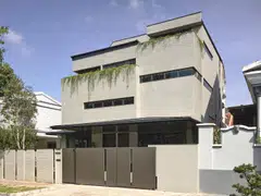 Don’t let the boxy exterior fool you – inside, it’s a sculptural space shaped by code and concrete.