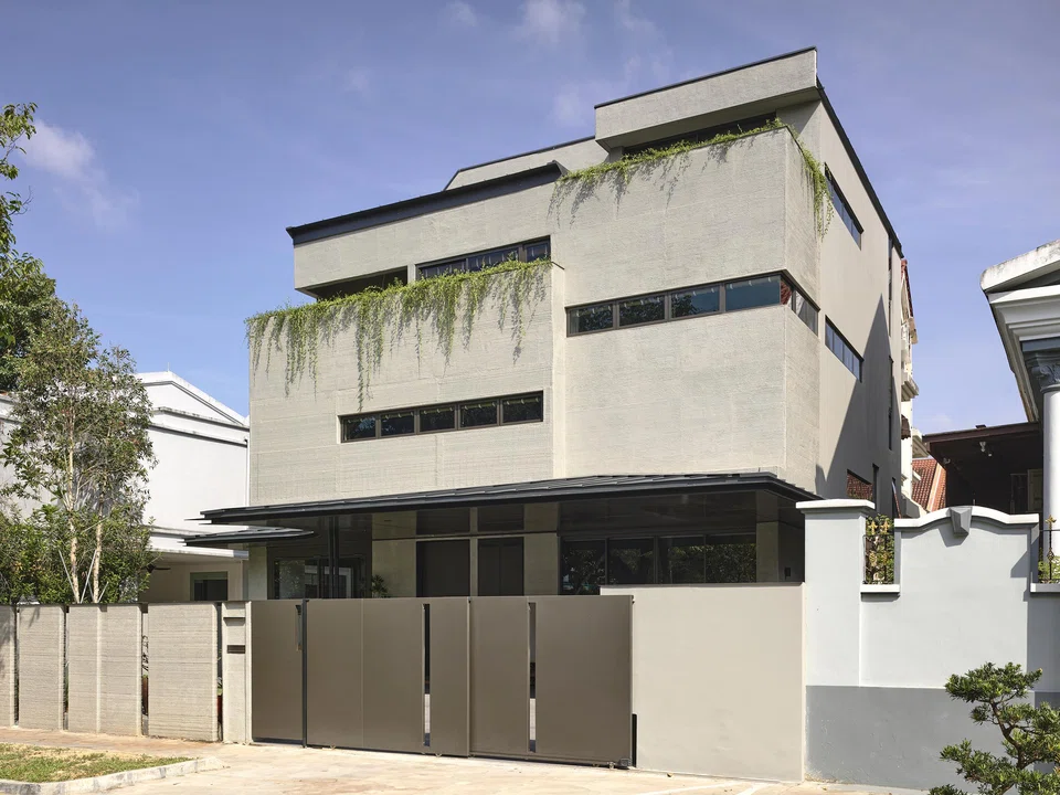 Don’t let the boxy exterior fool you – inside, it’s a sculptural space shaped by code and concrete.